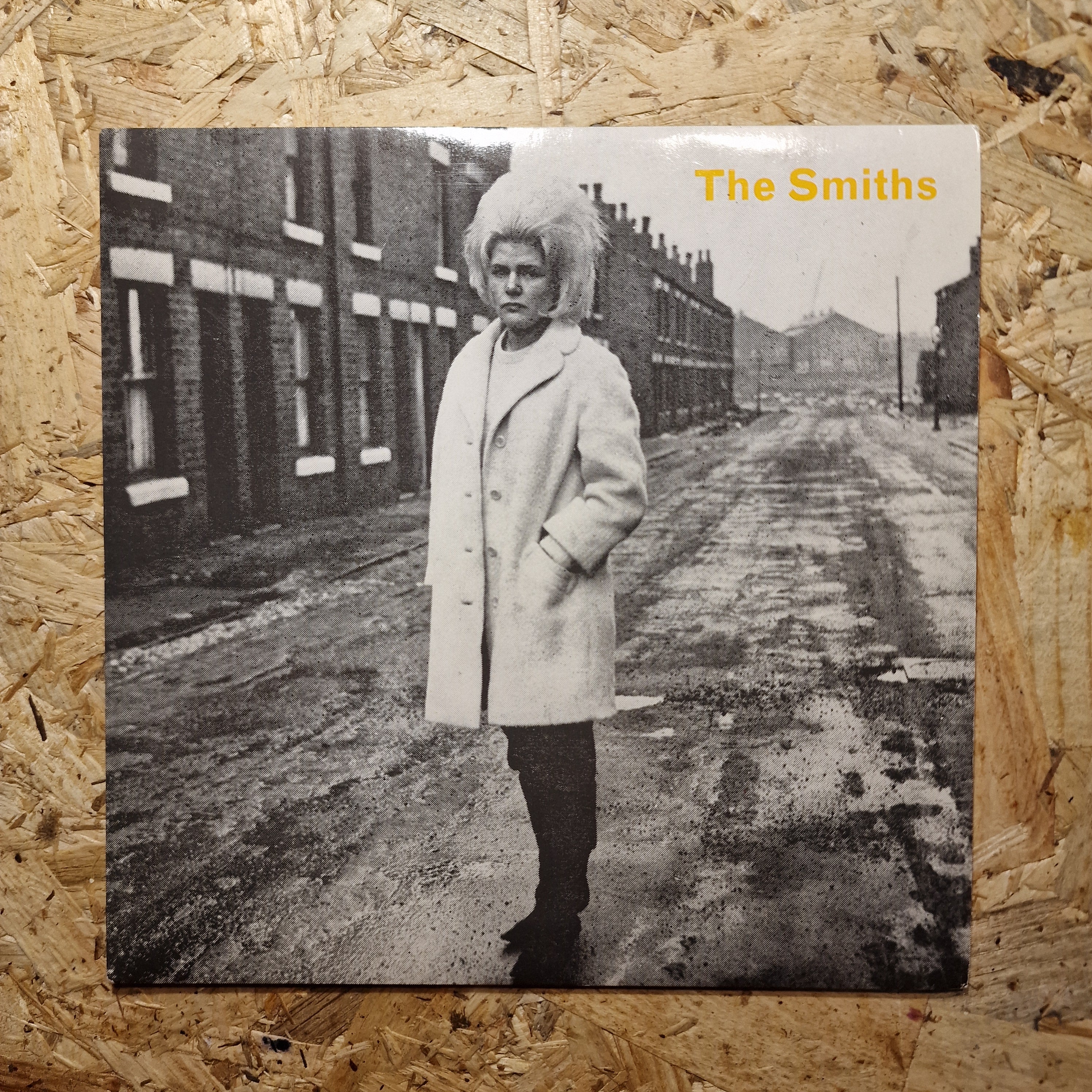 Cover of 'The Smiths' on a textured wooden surface
