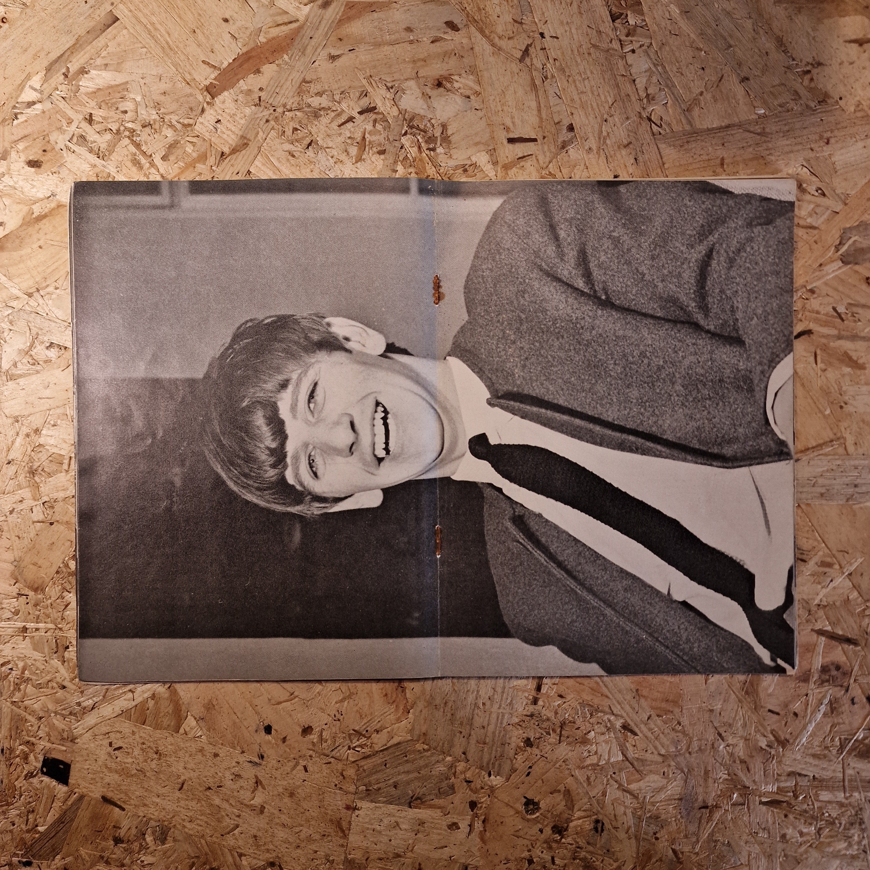 Vintage photograph of a person on a wooden surface