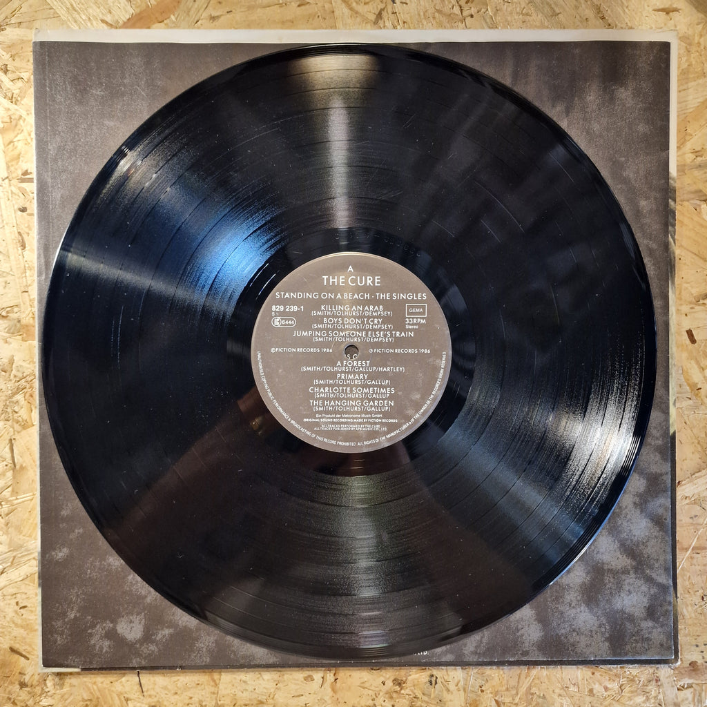The Cure – Standing On A Beach · The Singles